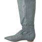 Gray knee-high boot on a white background