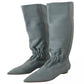 Pair of gray knee-high boots on a white background