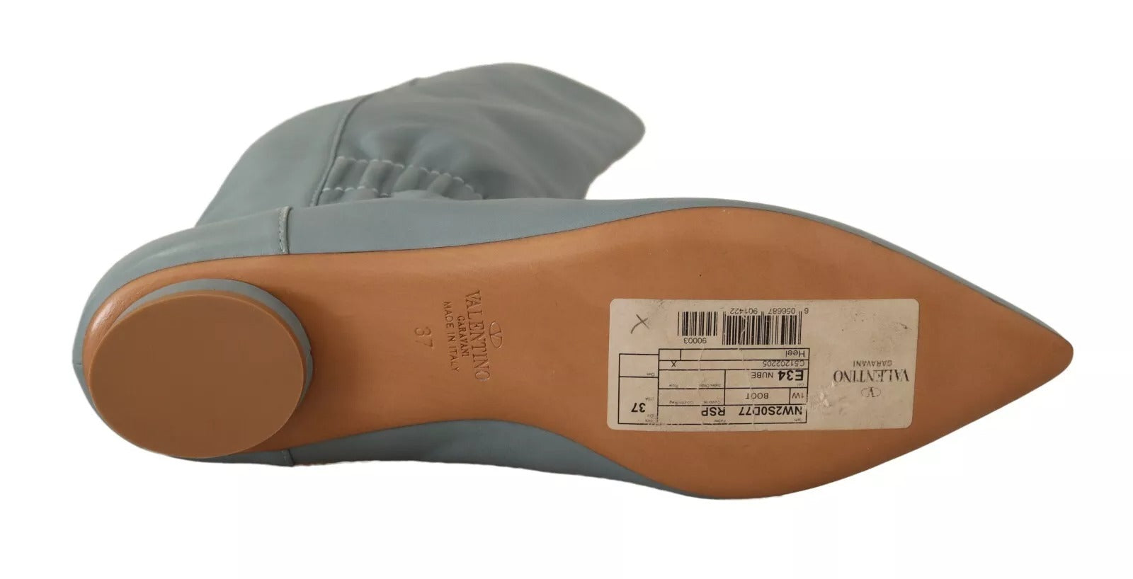 Gray shoe with a brown sole on a white background