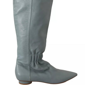Gray knee-high boot on a white background