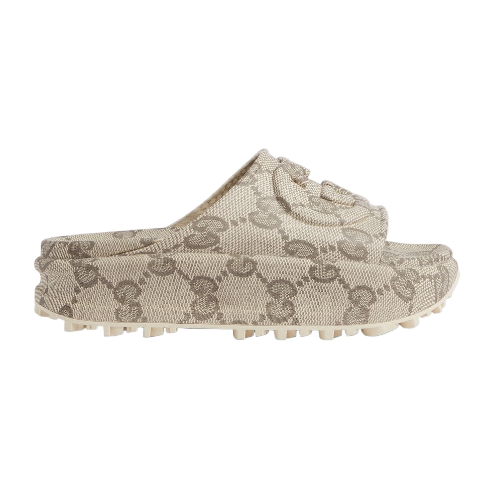 Beige slip-on shoes with a pattern on a light gray background
