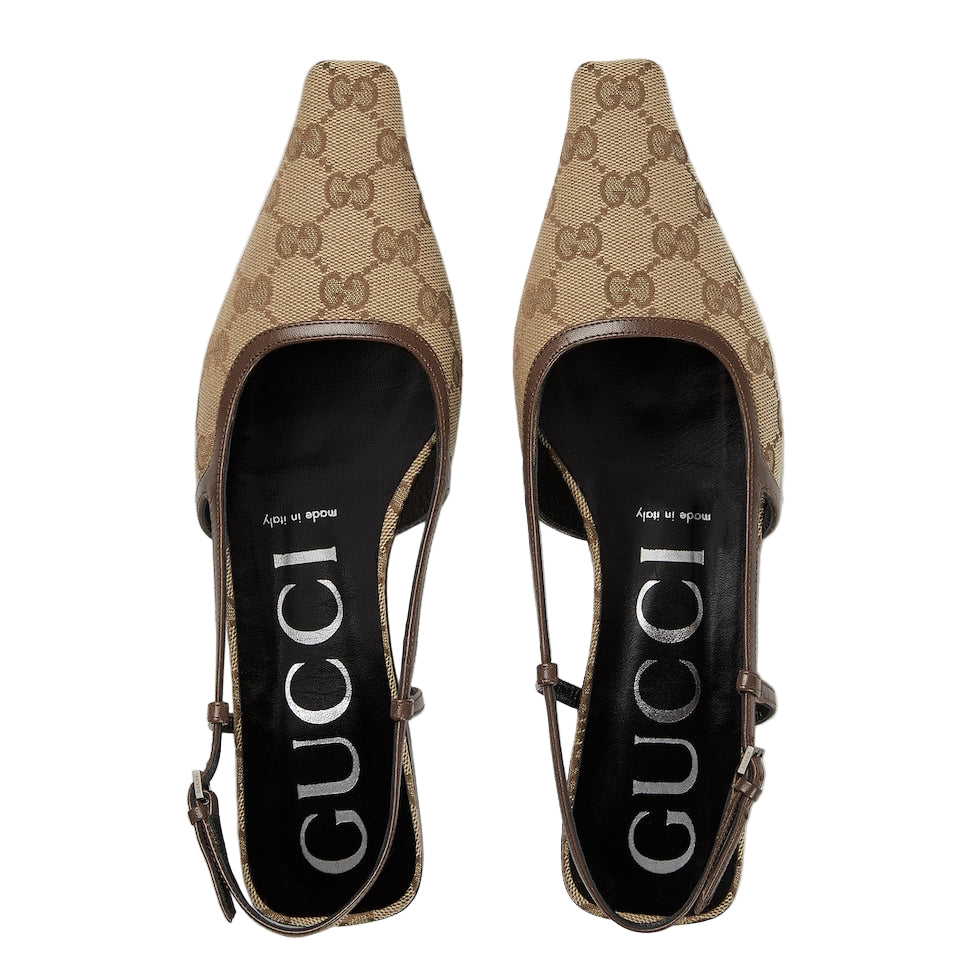 Pair of Gucci high heels on a light gray background