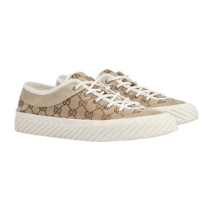Beige sneakers with a pattern on a white background