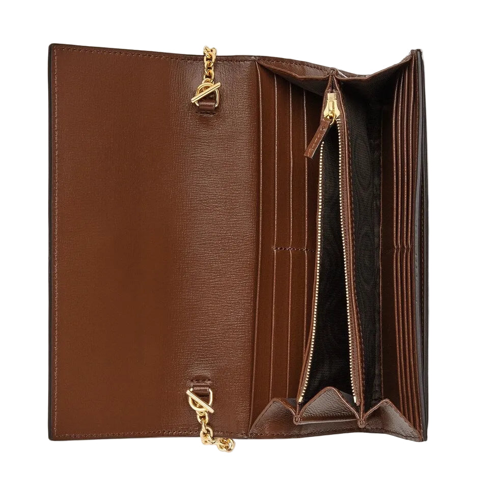 Brown leather wallet with gold zipper pulls on a light gray background