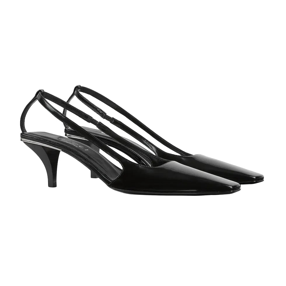 Black high-heeled shoes with slingback design on a white background
