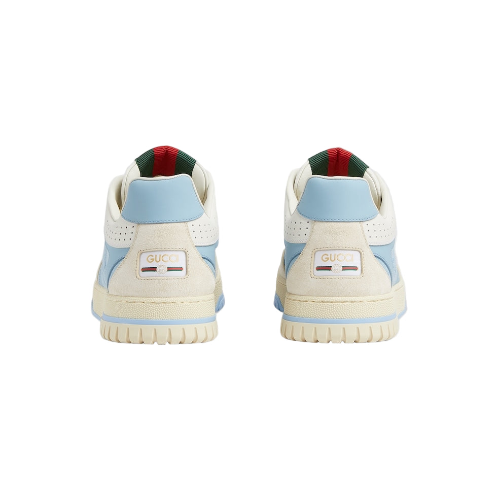 Pair of sneakers with visible brand logo on a light gray background