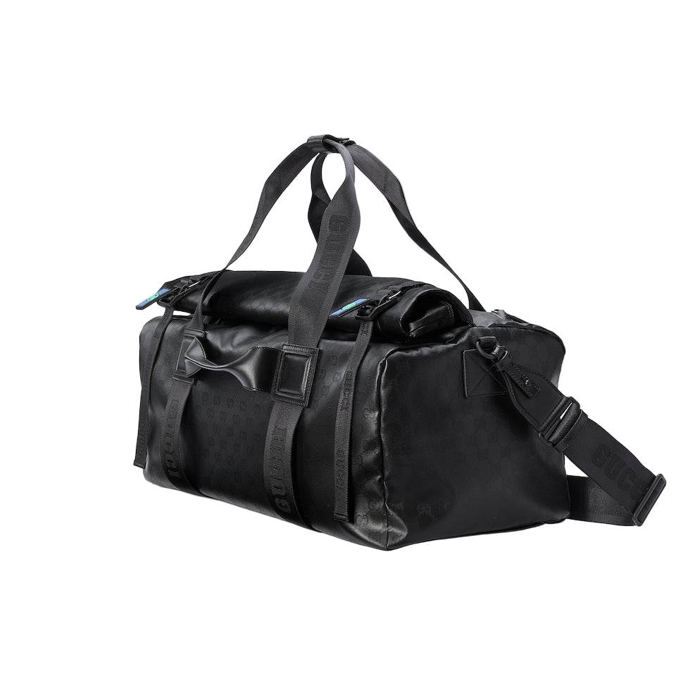 Black duffel bag with straps on a light gray background