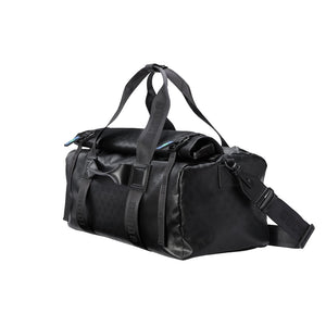 Black duffel bag with straps on a light gray background