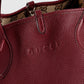 Close-up of a Gucci handbag with visible branding.