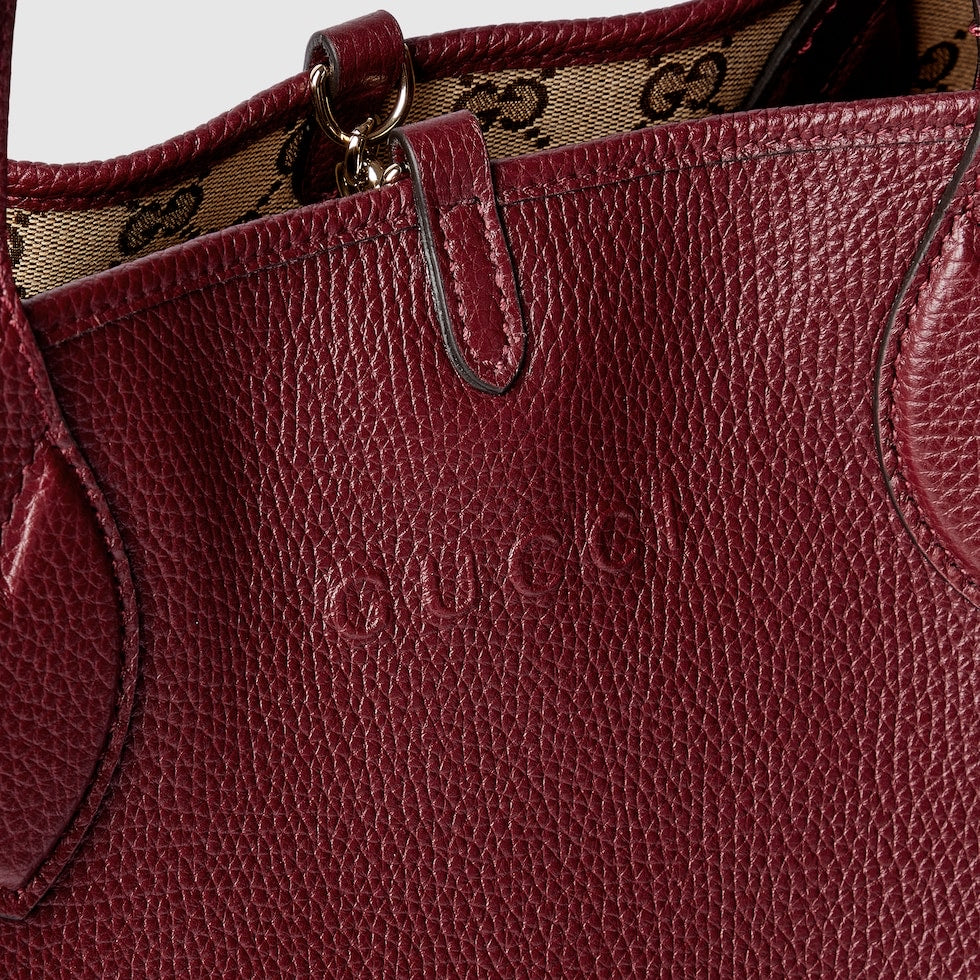 Close-up of a Gucci handbag with visible branding.