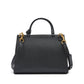 Black handbag with gold hardware on a white background