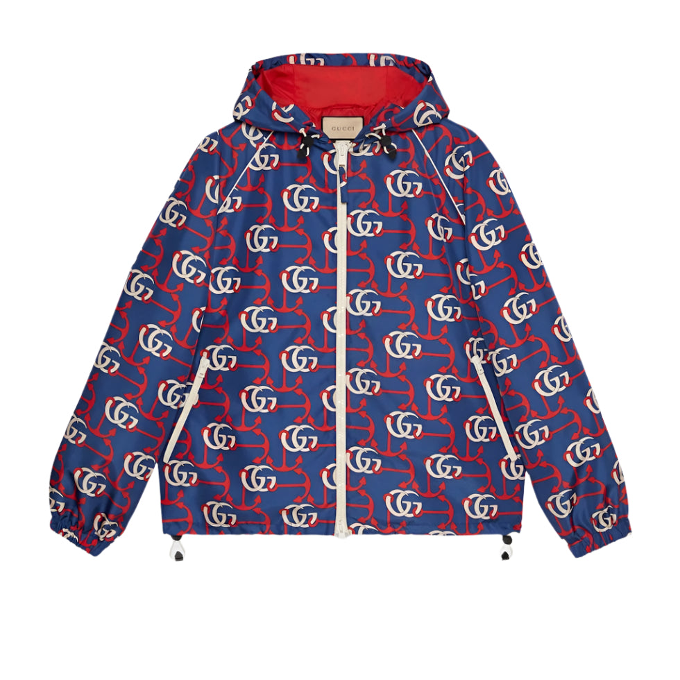 Blue Gucci jacket with red and white pattern on a light gray background