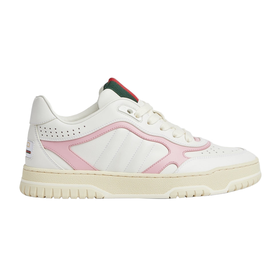 White sneaker with pink accents on a light gray background