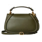 Green handbag with gold accents on a light gray background