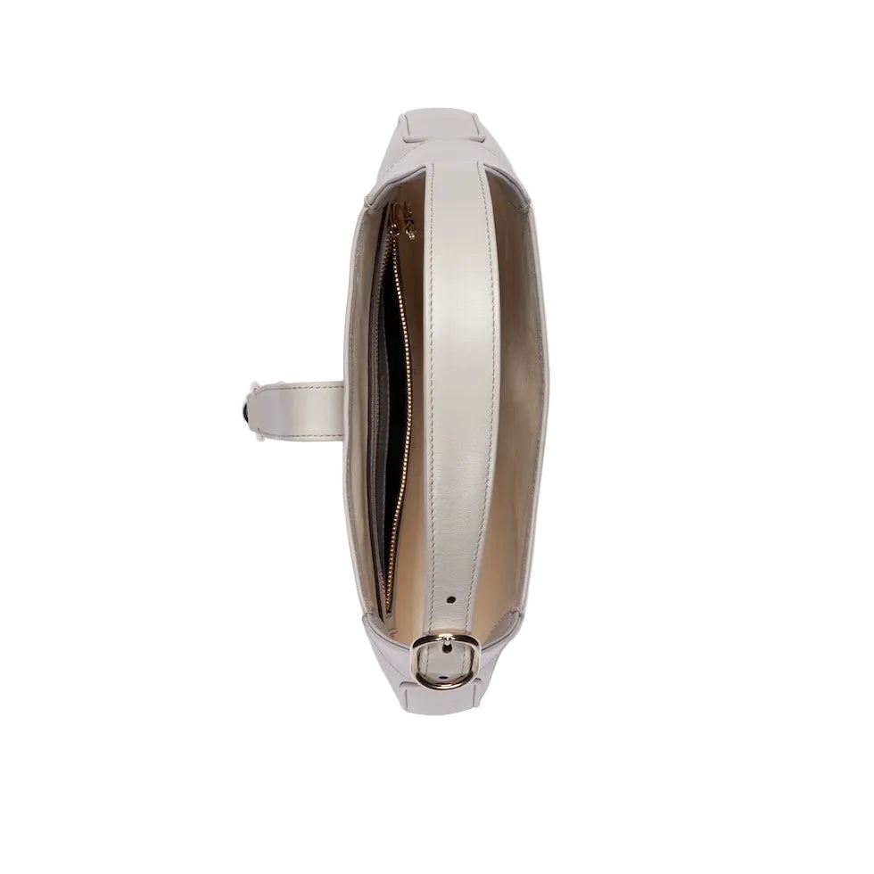 Silver ring with a reflective surface on a light gray background