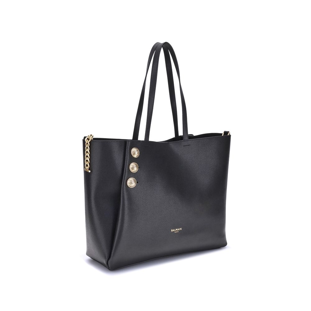 Black handbag with gold chain and buttons on a white background