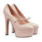 Pair of beige high-heeled platform shoes on a light gray background
