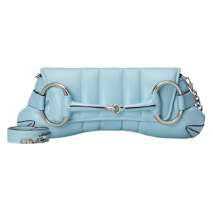 Light blue Gucci Horsebit quilted handbag with silver hardware on a light gray background