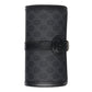 Black patterned cylindrical product with a buckle on a light gray background