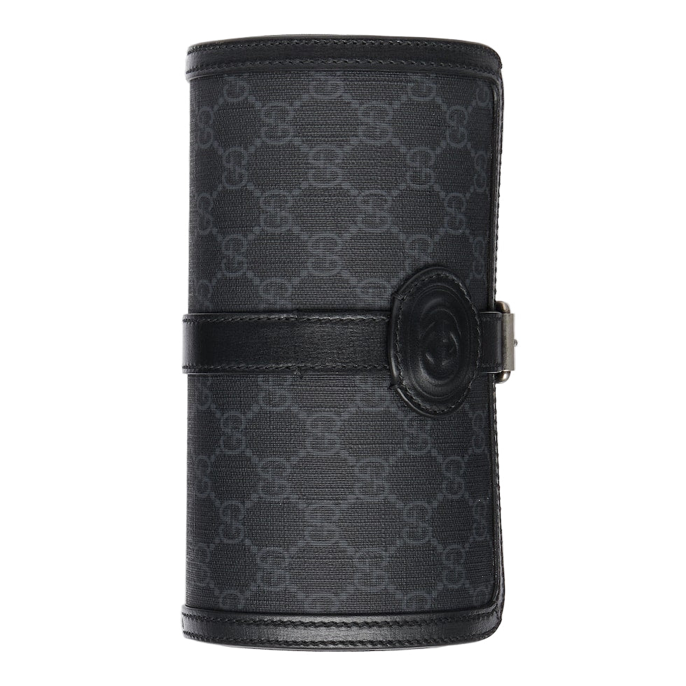 Black patterned cylindrical product with a buckle on a light gray background