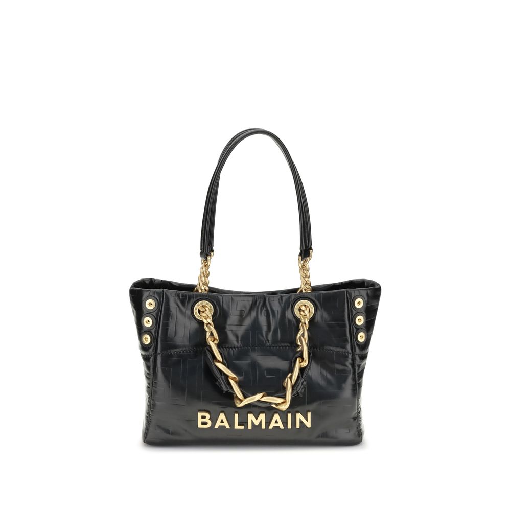 Black handbag with gold chain and 'Balmain' branding on a white background