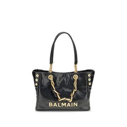 Black handbag with gold chain and 'Balmain' branding on a white background