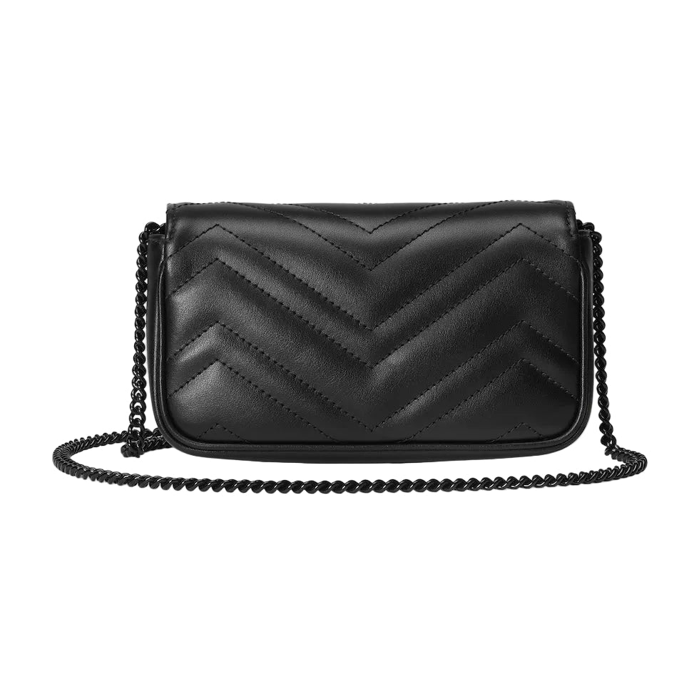Black quilted handbag with chain strap on a light gray background