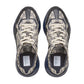 Pair of Gucci sneakers with patterned design on a light gray background