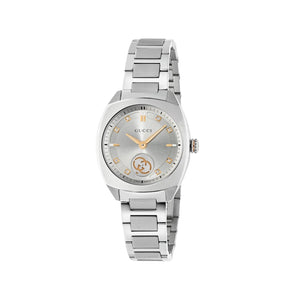 Silver Gucci watch on a light gray background