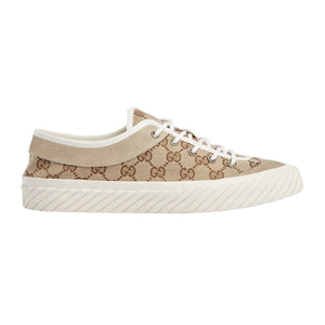 Beige sneaker with brown pattern on a light gray background
