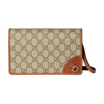 Beige handbag with brown accents on a light gray background