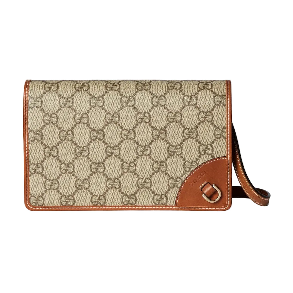 Beige handbag with brown accents on a light gray background