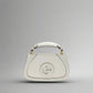 White handbag with a brand logo on a white background