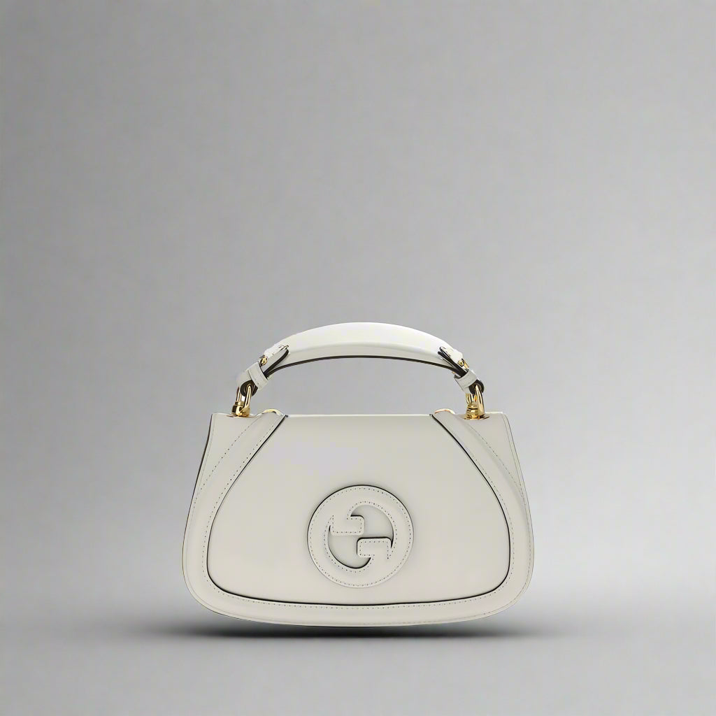 White handbag with a brand logo on a white background