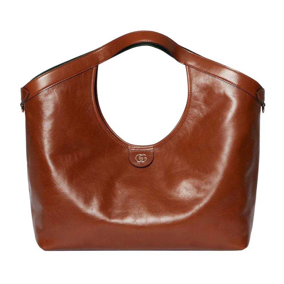 Brown leather handbag on a light gray background