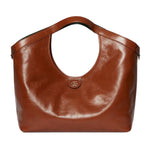 Brown leather handbag on a light gray background