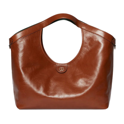 Brown leather handbag on a light gray background