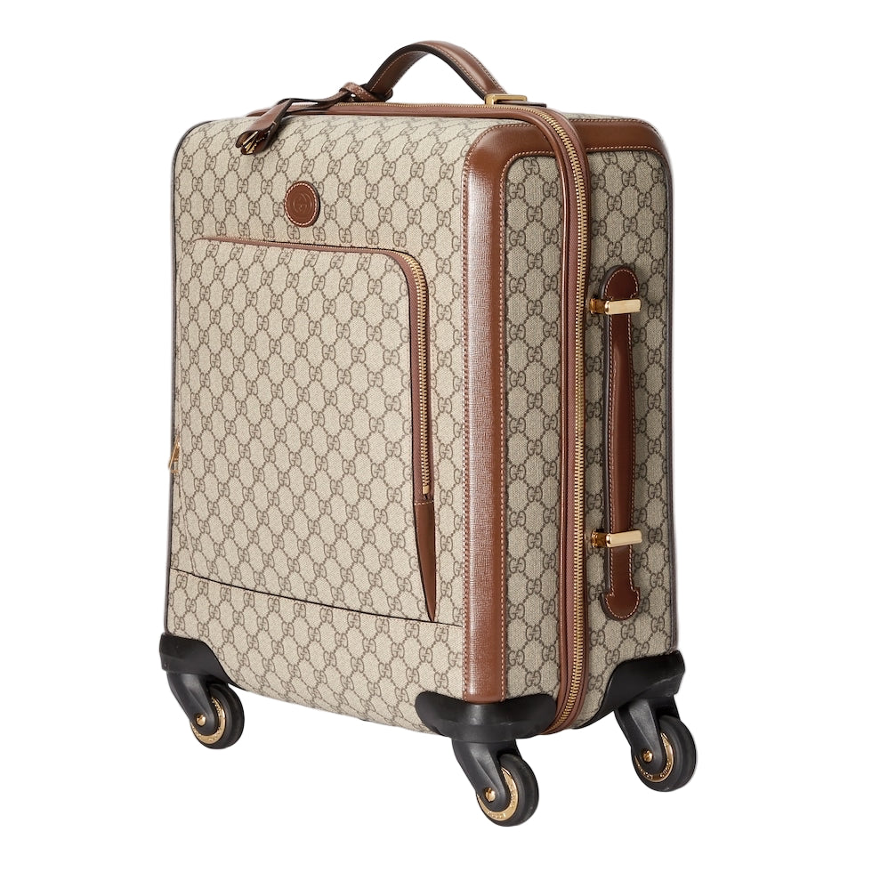 Beige suitcase with brown accents on a light gray background