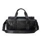 Black Gucci duffel bag on a light gray background