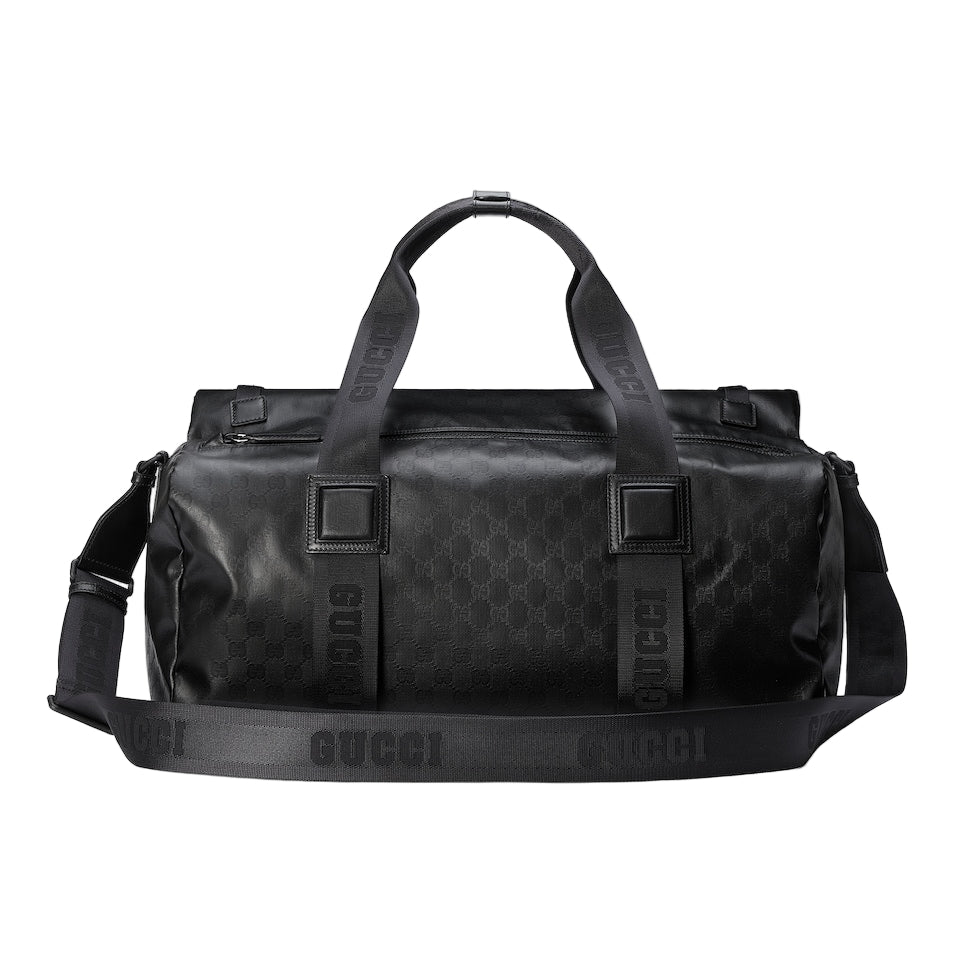 Black Gucci duffel bag on a light gray background