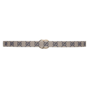 Beige belt with black pattern and gold buckle on a white background