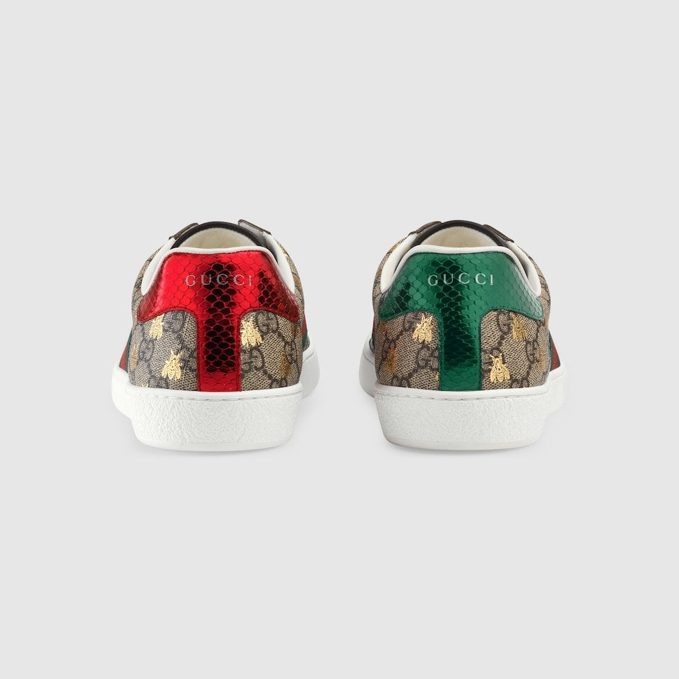 Two Gucci sneakers with colorful patterns on a white background