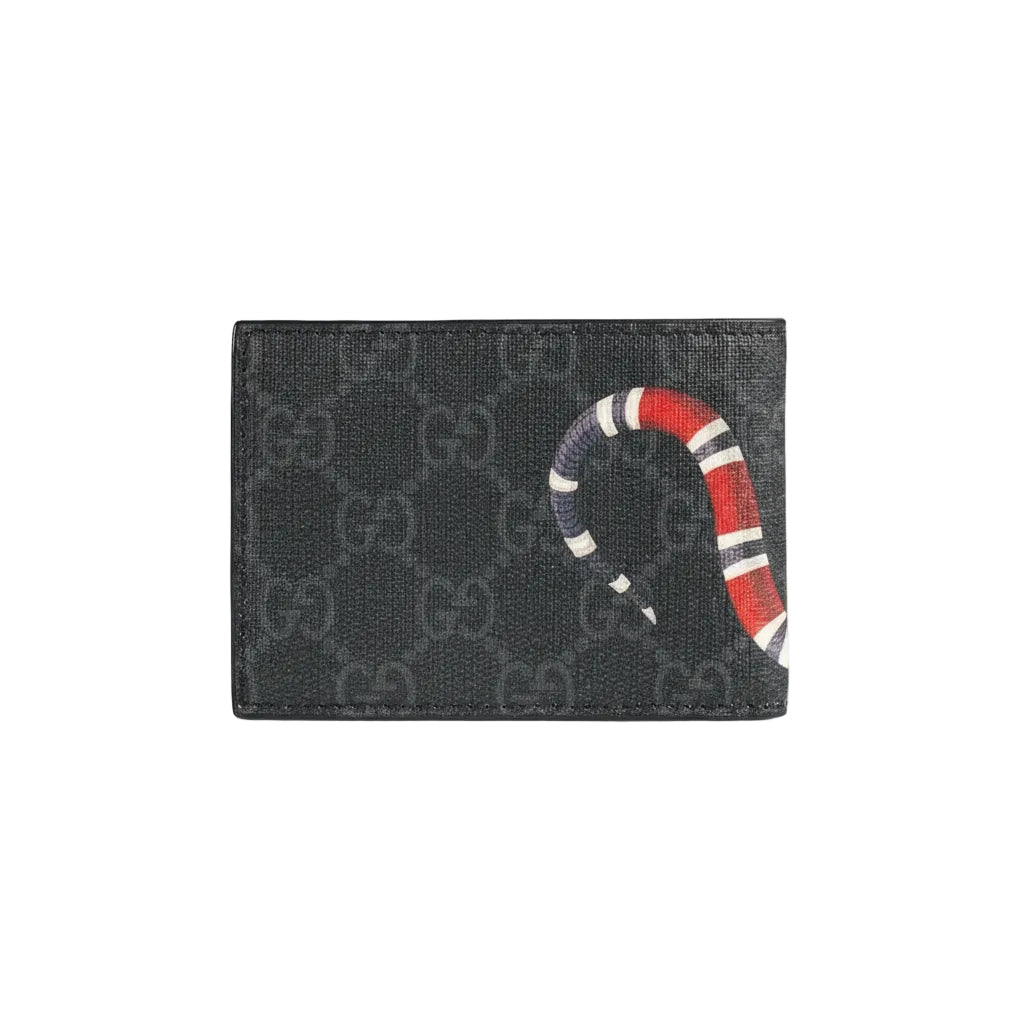 Gucci cardholder with monogram pattern and snake design on a light gray background
