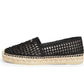 Black woven espadrille shoe on a white background