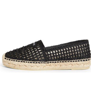 Black woven espadrille shoe on a white background