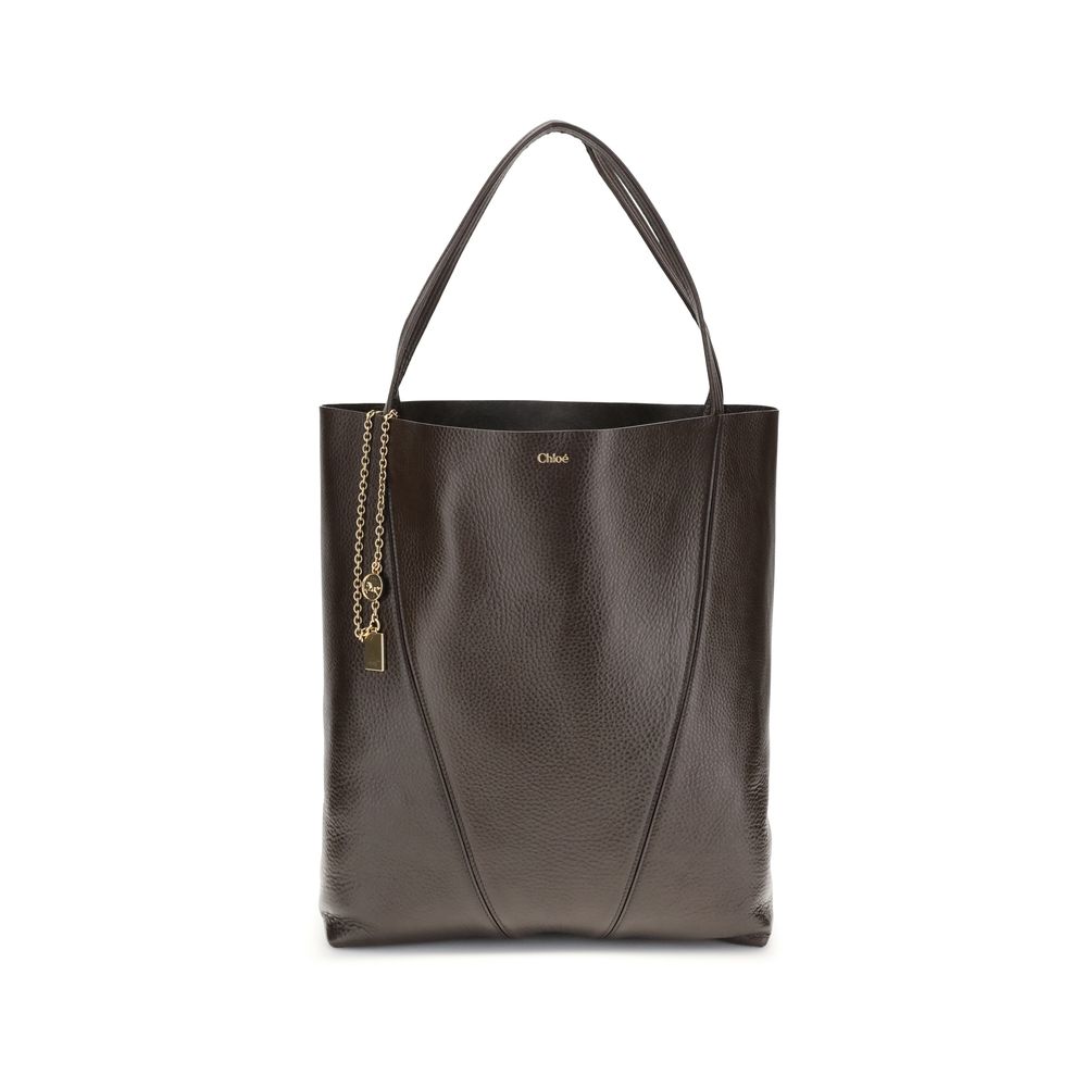 Brown leather tote bag with a chain detail on a white background
