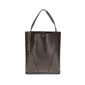 Brown leather tote bag with a chain detail on a white background