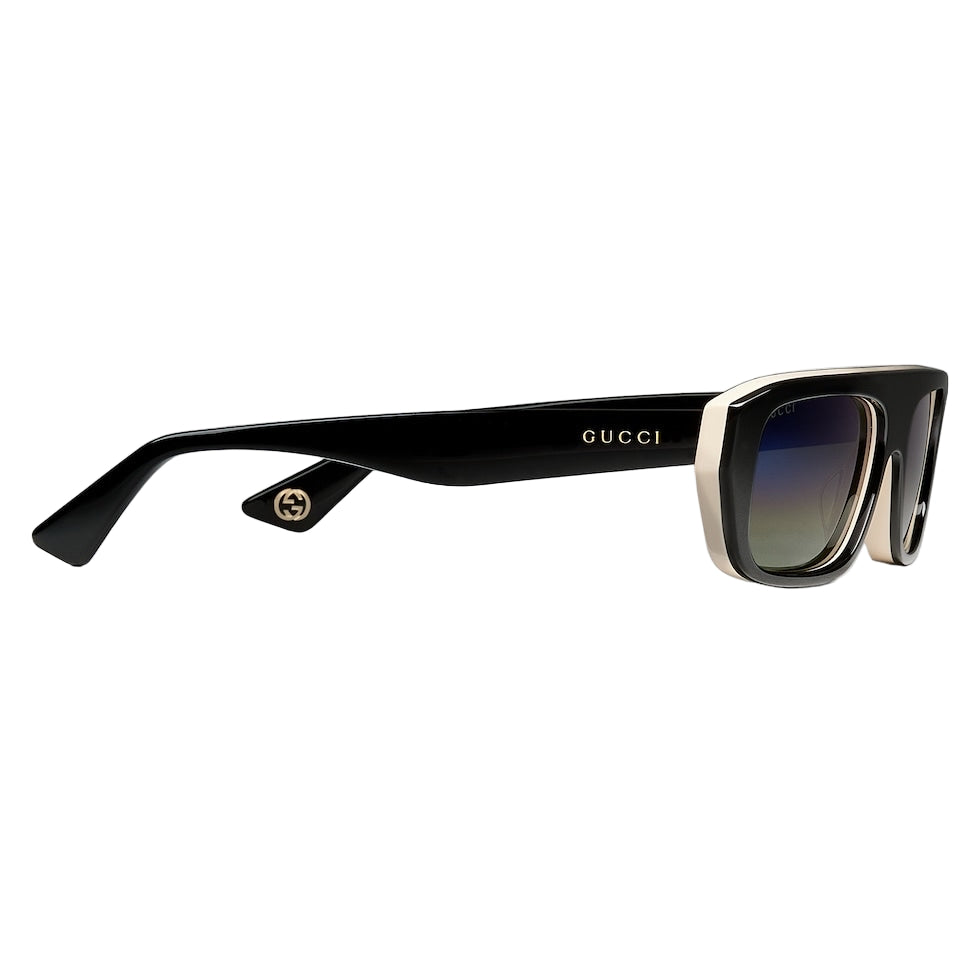 Black Gucci sunglasses on a light gray background