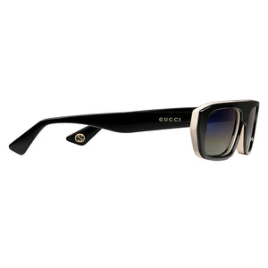 Black Gucci sunglasses on a light gray background