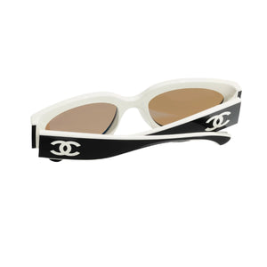 Sunglasses with a black and white design on a white background